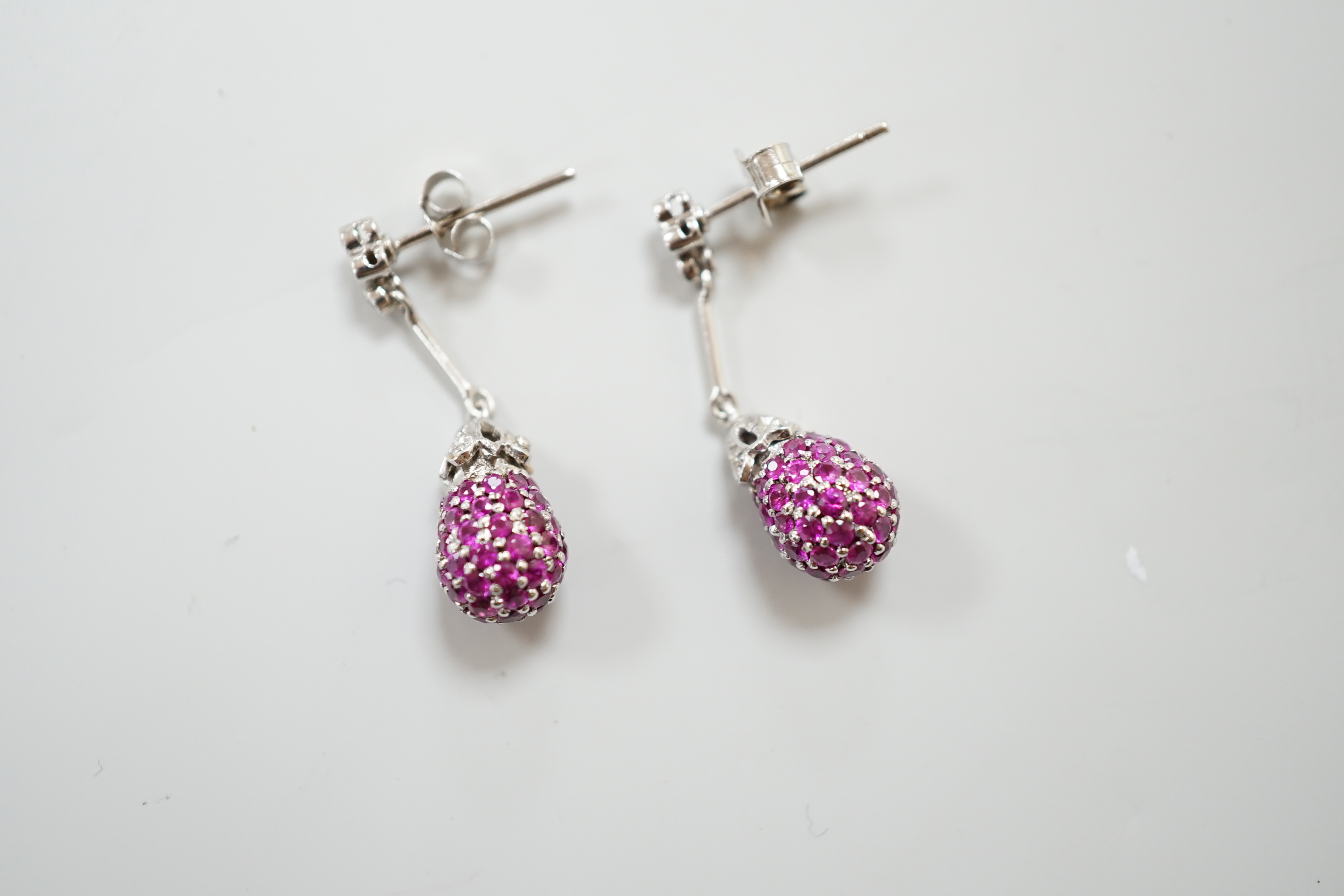 A pair of 18ct white gold ruby and diamond set drop earrings, 2.7cm, gross 5.5 grams
